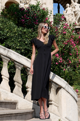a lady wears a black maxi dress